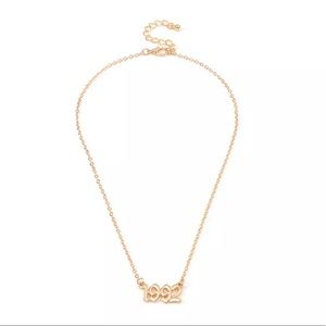 Stainless steel gold tone 1992 necklace